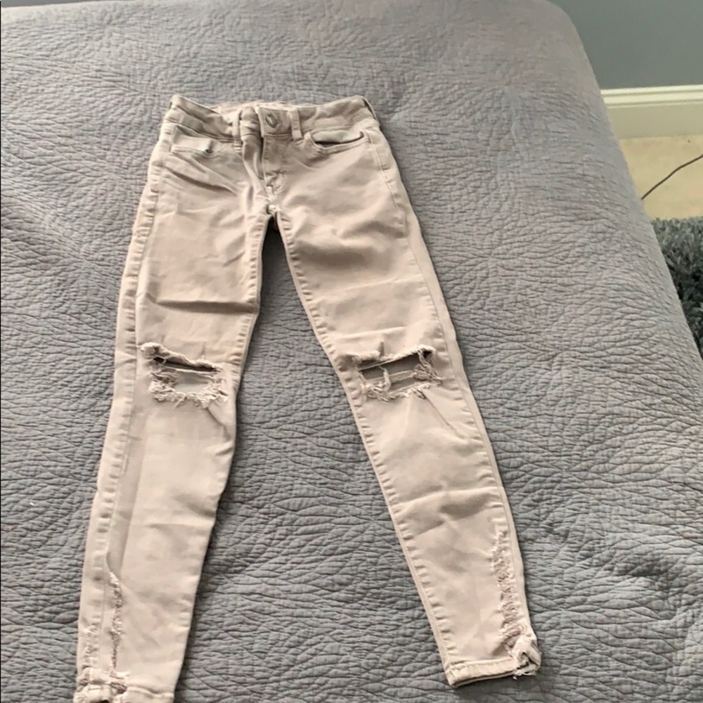 Light purple ripped jeans